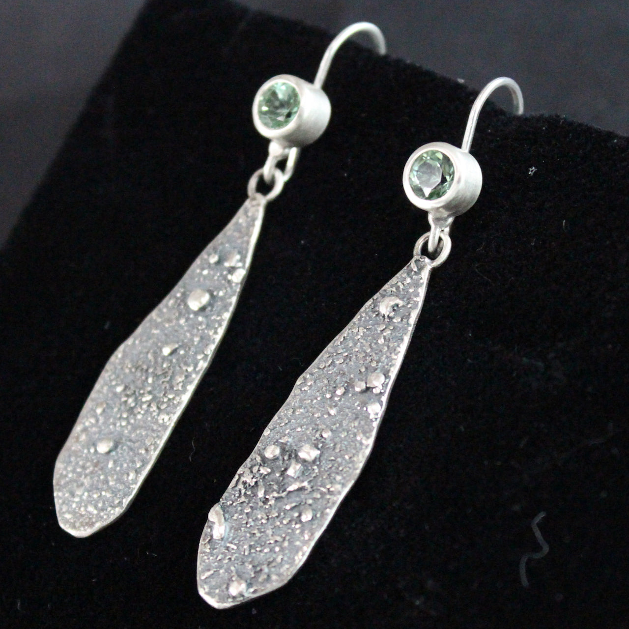 Mint green tourmaline drop earrings in textured sterling silver close up