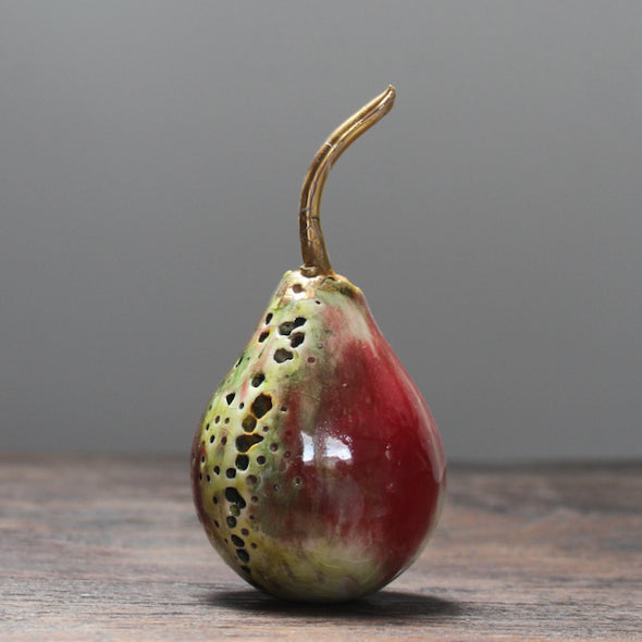 ceramic red and green pear and a gold stalk by ceramic artist Remon Jephcott.