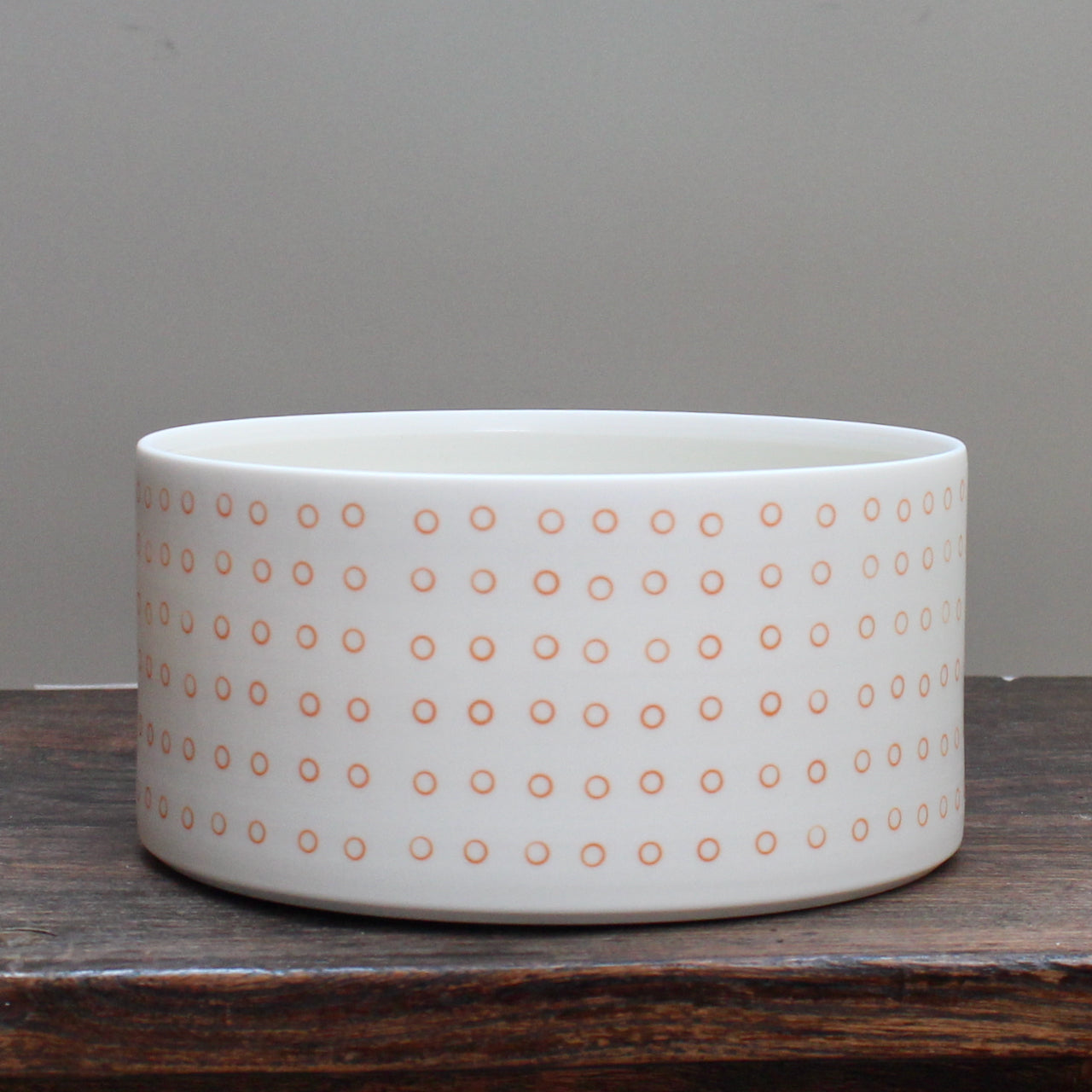 porcelain dish decorated with small orange circles 