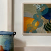 framed abstract painting by Tara Leaver inspired by shapes and colours under the sea, oranges blues and purples  next to ceramic pot in blues and oranges by John Pollex