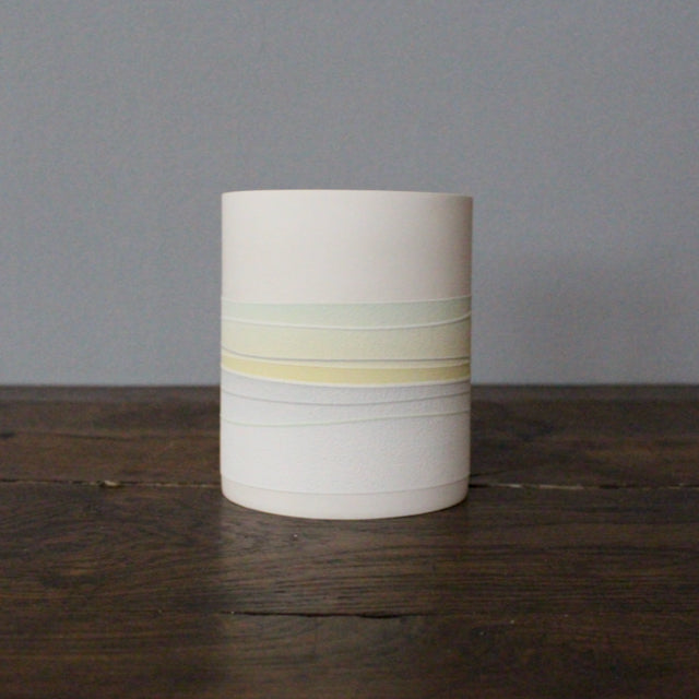 ceramic pot with pastel line decoration