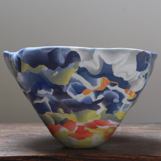 large porcelain Nerikomi bowl in orange, red, yellow blue and white  by Judy McKenzie.