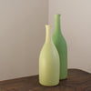 two pale green ceramic bottles by UK ceramic artist Lucy Burley.