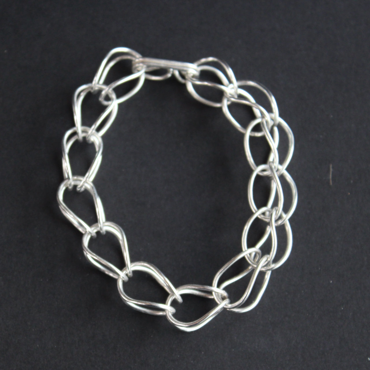 a silver chain bracelet  by Amy Stringer Uk jeweller.