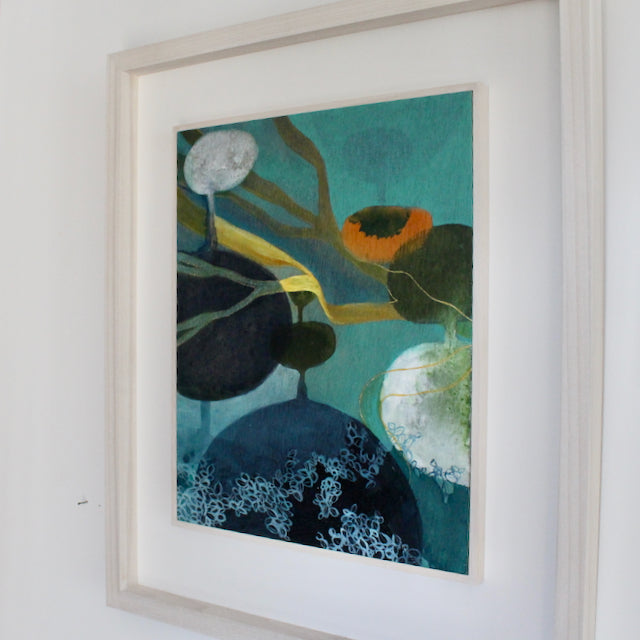 framed abstract painting of the sea by Cornwall artist Tara Leaver in blue, orange and yellow 