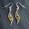 Plantae wave earrings with gold leaves by Beverly Bartlett