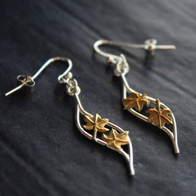 Plantae wave earrings with gold leaves by Beverly Bartlett