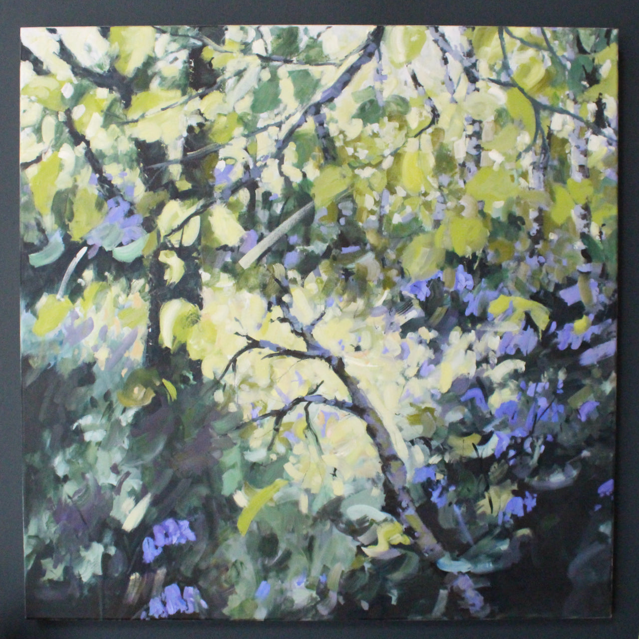 An oil painting of bluebells in a wood by artist Jill Hudson.