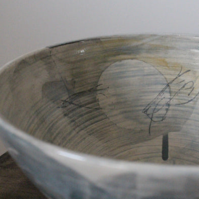 close up detail of large ceramic bowl glazed in pale greys and yellows made by UK ceramicist Kate Welton 