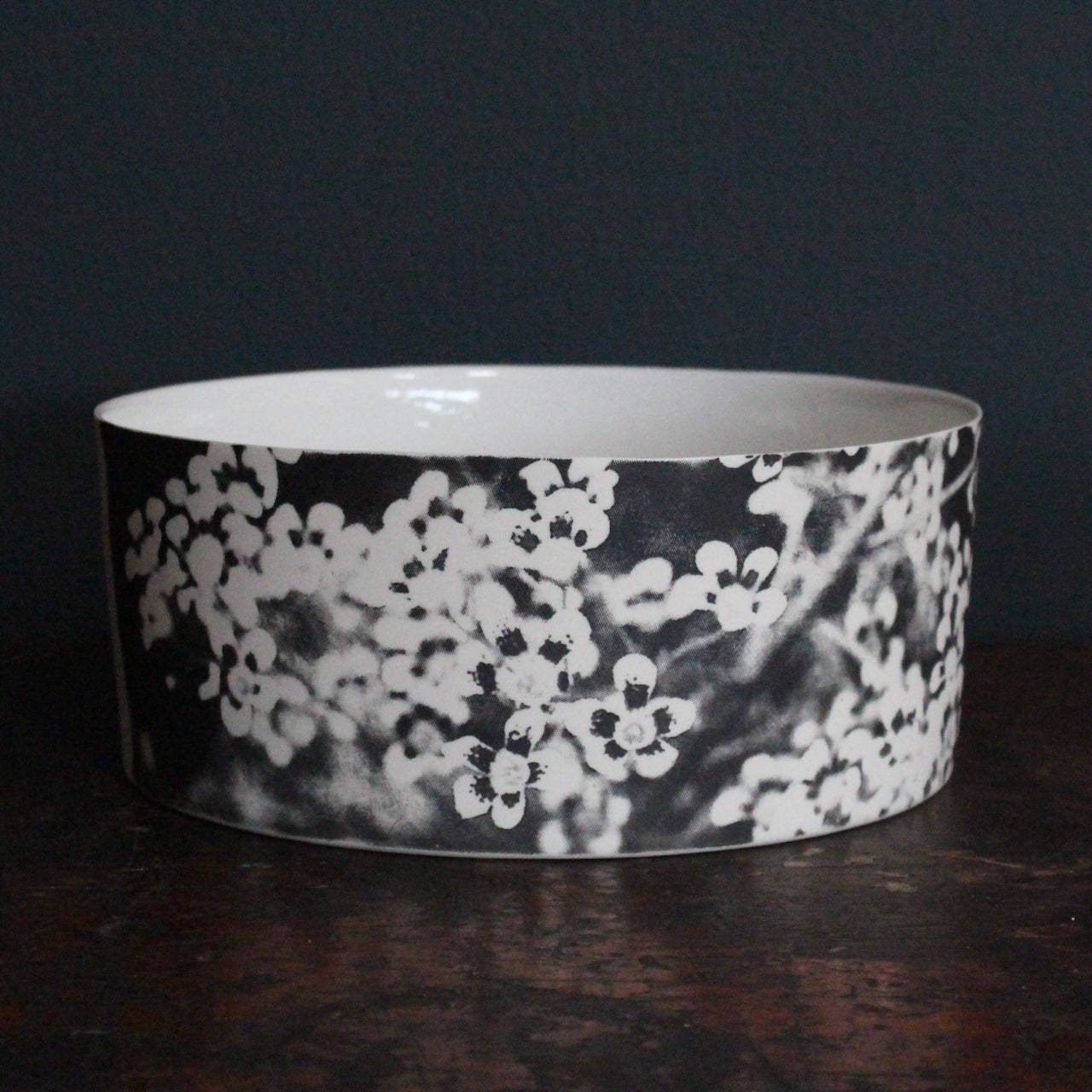 Heidi Harrington ceramic bowl with black and white pansy design on the exterior and a cream glazed interior