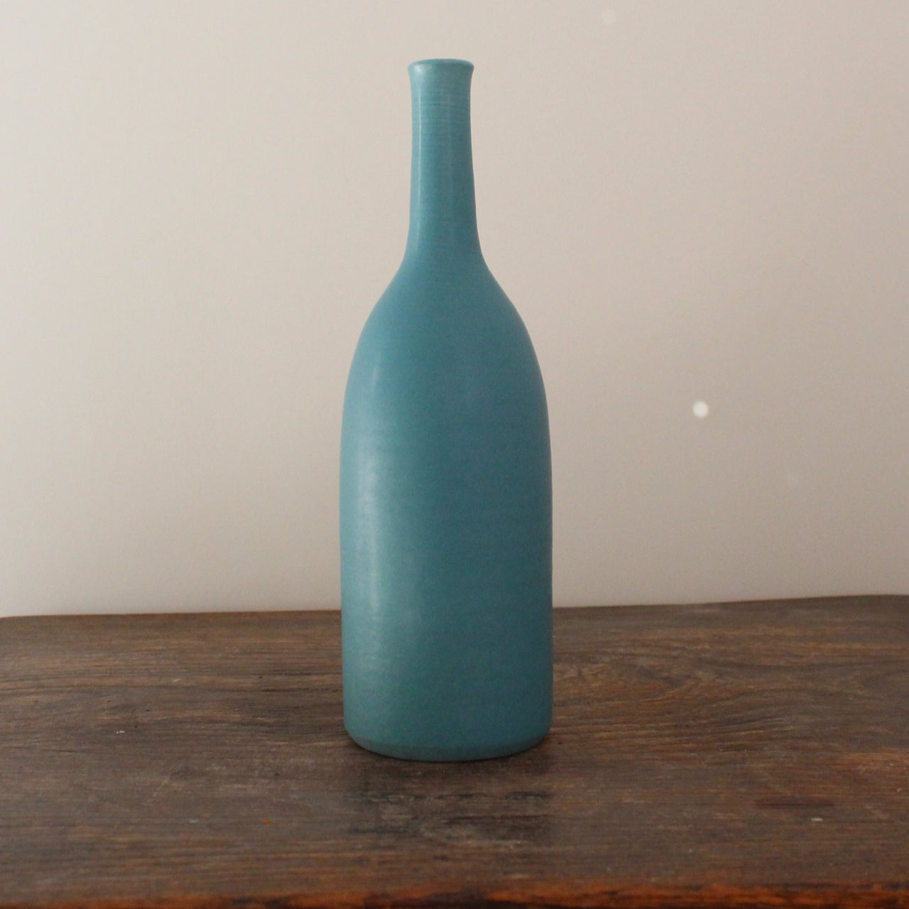 dark turquoise coloured ceramics bottle by English ceramicist Lucy Burley 