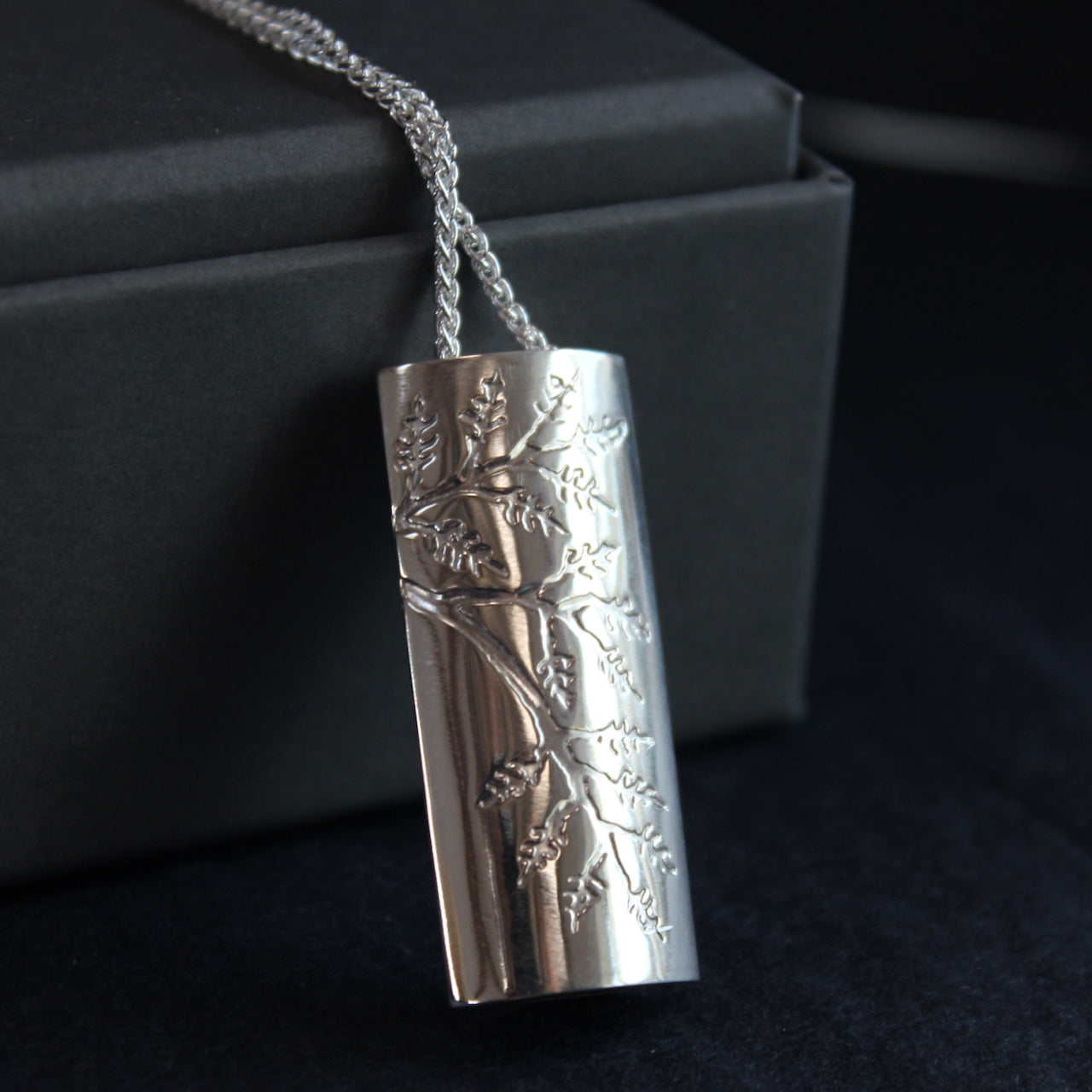 Plantae pendant embossed with ash leaves in silver by Beverly Bartlett