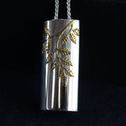 Plantae pendant with gold ash leaves in silver by Beverly Barlett