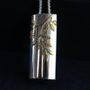 Plantae pendant with gold ash leaves in silver by Beverly Barlett