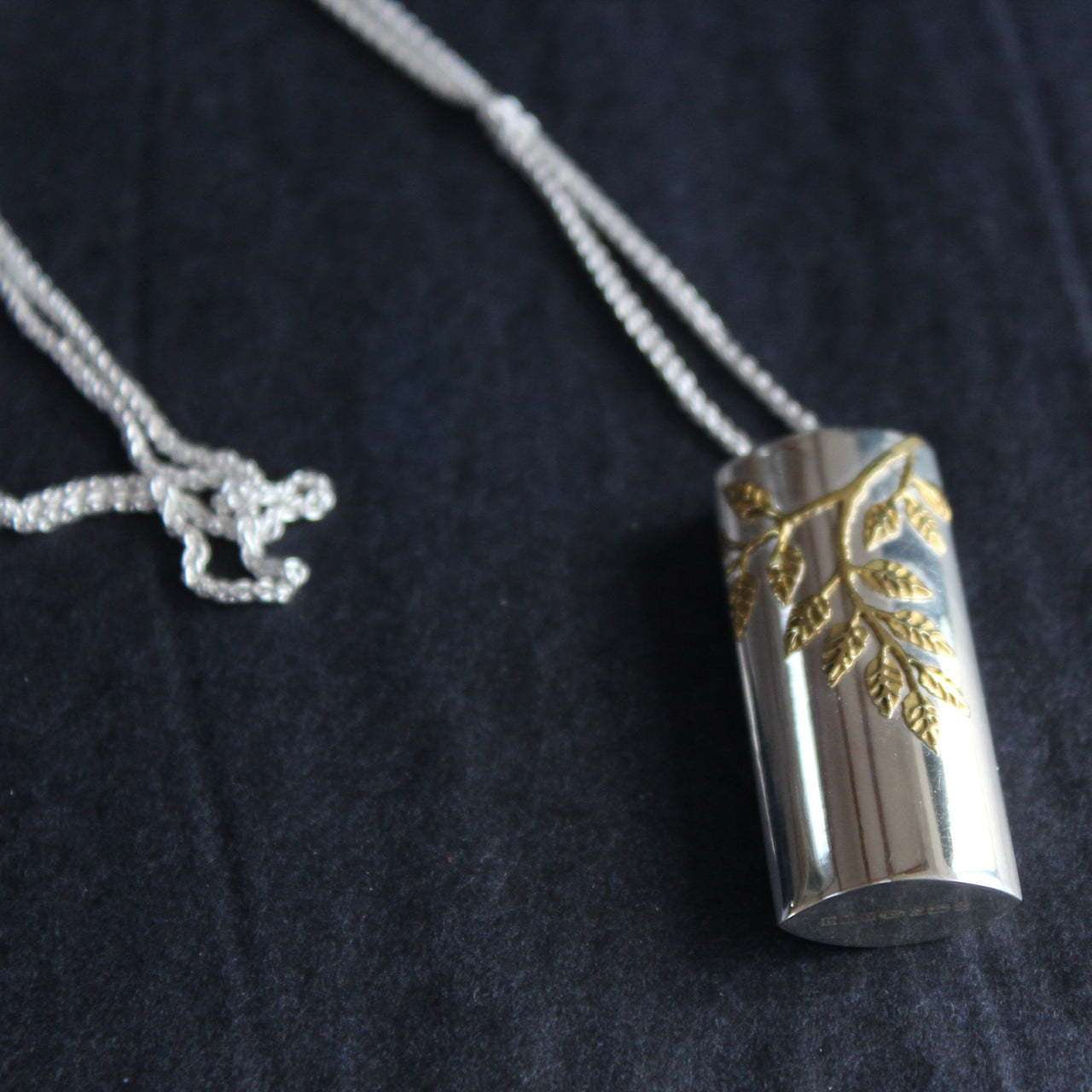 Plantae pendant with gold ash leaves in silver by Beverly Barlett